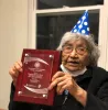 Virginia Beavert holds the Ken Hale Award plaque from AILDI